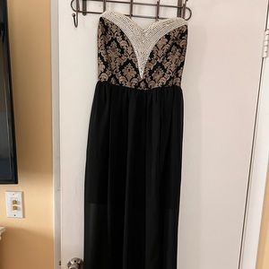 Long split thigh black dress with pearl top.